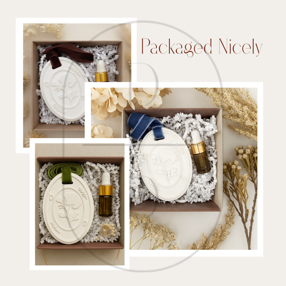 A collage of pictures highlighting the packaging for the handmade custom jesmonite aroma stone pendants. Nestled in a white box, cushioned by crinkle paper, and paired with a ml dropper bottle of fragrance oil.